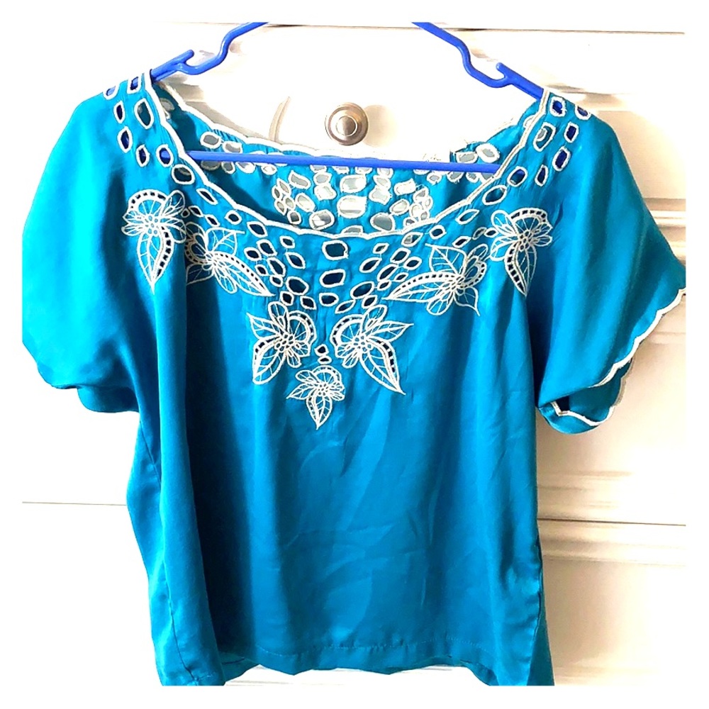 Blue flow-y blouse with a white flower embroidery